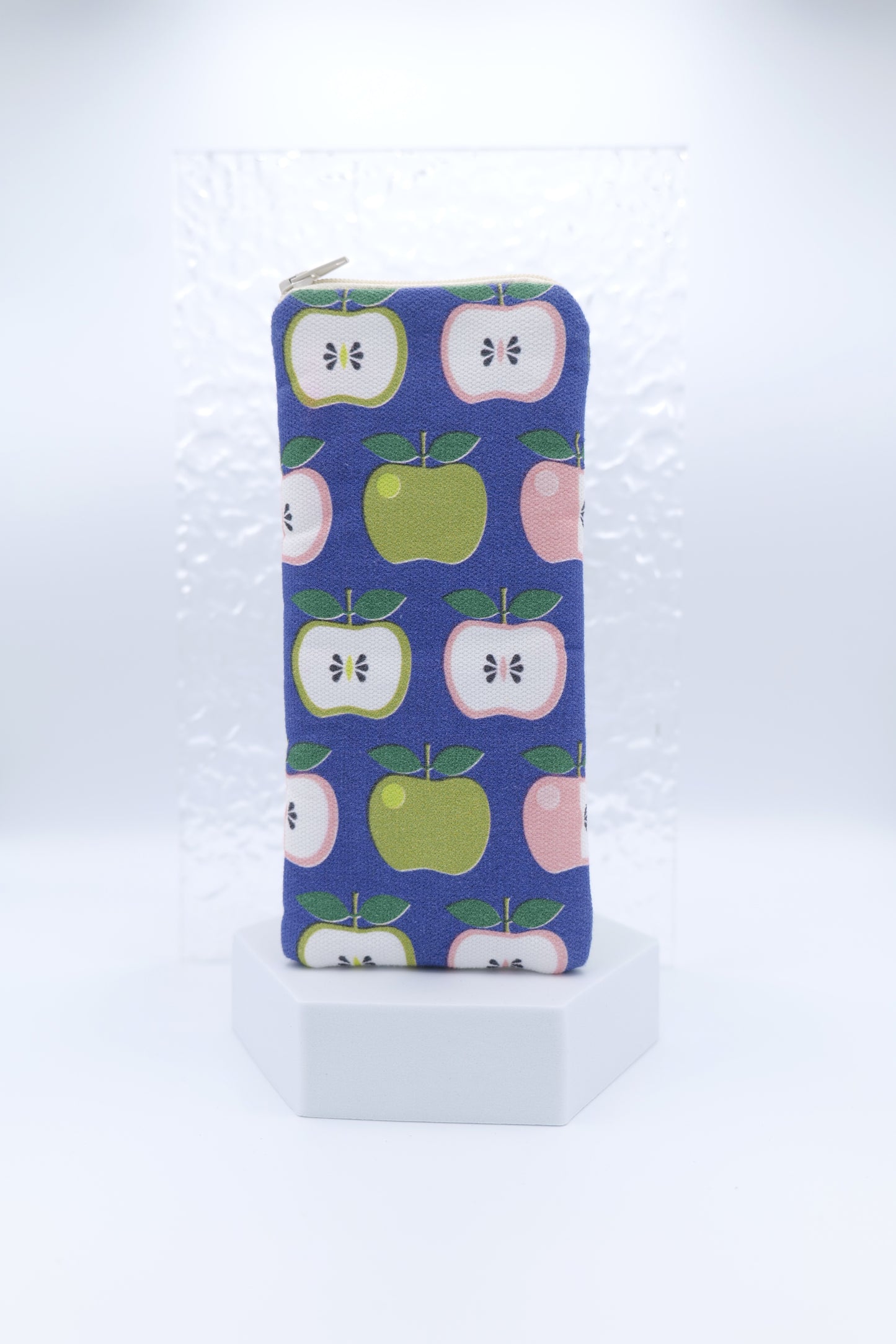 Glasses case featuring the Apples design with retro style apples in green, pink, and white  on a dark blue background; made from cotton canvas with a zip-top closure, padded and lined to protect lenses, handmade in Melbourne.