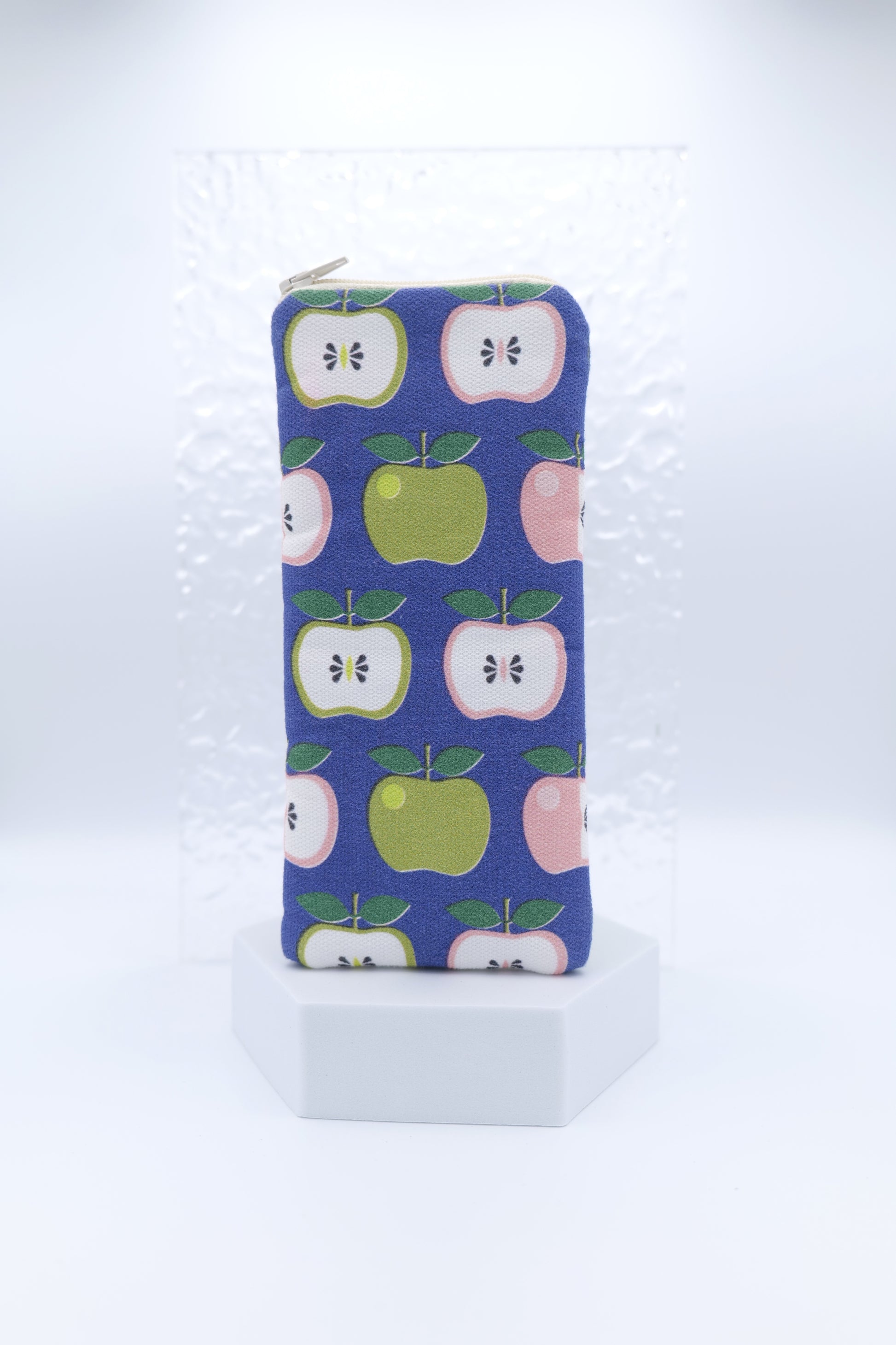 Glasses case featuring the Apples design with retro style apples in green, pink, and white  on a dark blue background; made from cotton canvas with a zip-top closure, padded and lined to protect lenses, handmade in Melbourne.