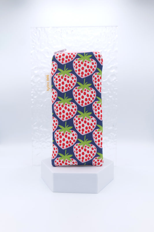 Glasses case featuring a Blue Strawberries design with oversized red and white strawberries scattered across a navy background; made from cotton canvas with a zip‑top closure, padded and lined to protect lenses, handmade in Melbourne and certified Australian Made; pattern placement may vary slightly due to the handmade nature of the product.