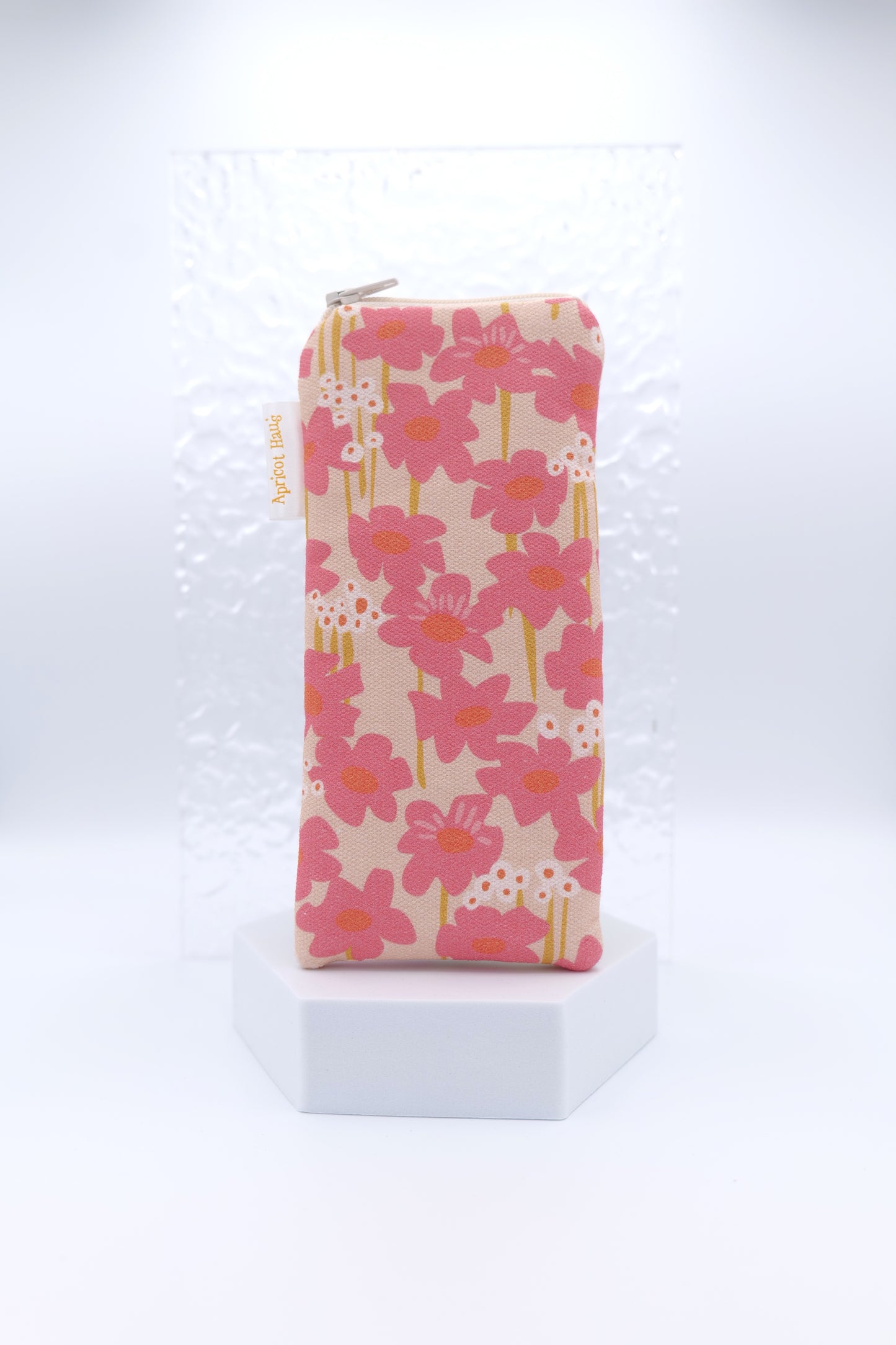 Blush Flowers Glasses Case with pink flowers in a flat illustrated style and white accents, on a soft beige background; handmade in Melbourne from cotton canvas, padded and lined with cotton, glasses case has a zip top and certified Australian made
