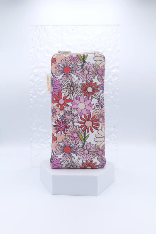 Glasses case featuring Chelsea Nude design, a retro-inspired, nude‑toned floral arrangement on cotton canvas; made with a zip‑top closure, padded and lined to protect lenses, handmade in Melbourne and certified Australian Made; pattern placement may vary slightly due to the handmade nature of the product.