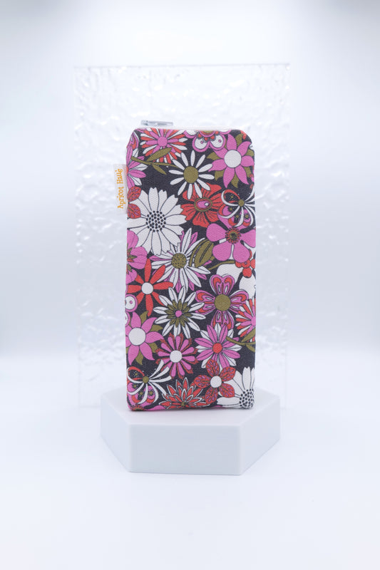 Glasses case featuring Chelsea Red design with bold red, pink, white and olive flowers on a black background; handmade from cotton canvas with a zip-top closure, padded and lined to protect lenses, handmade in Melbourne and certified Australian made; pattern placement may vary slightly due to the handmade nature of the product.