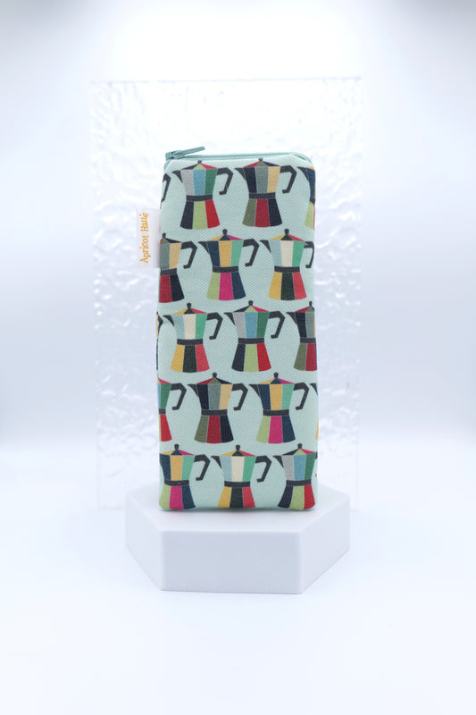 Glasses case featuring a Coffee Pot design with colourful moka pots in red, green, yellow, pink and black on a pale blue background; made from cotton canvas with a zip-top closure, padded and lined to protect lenses, handmade in Melbourne and certified Australian Made; matching tea towel available; pattern placement may vary slightly due to the handmade nature of the product.