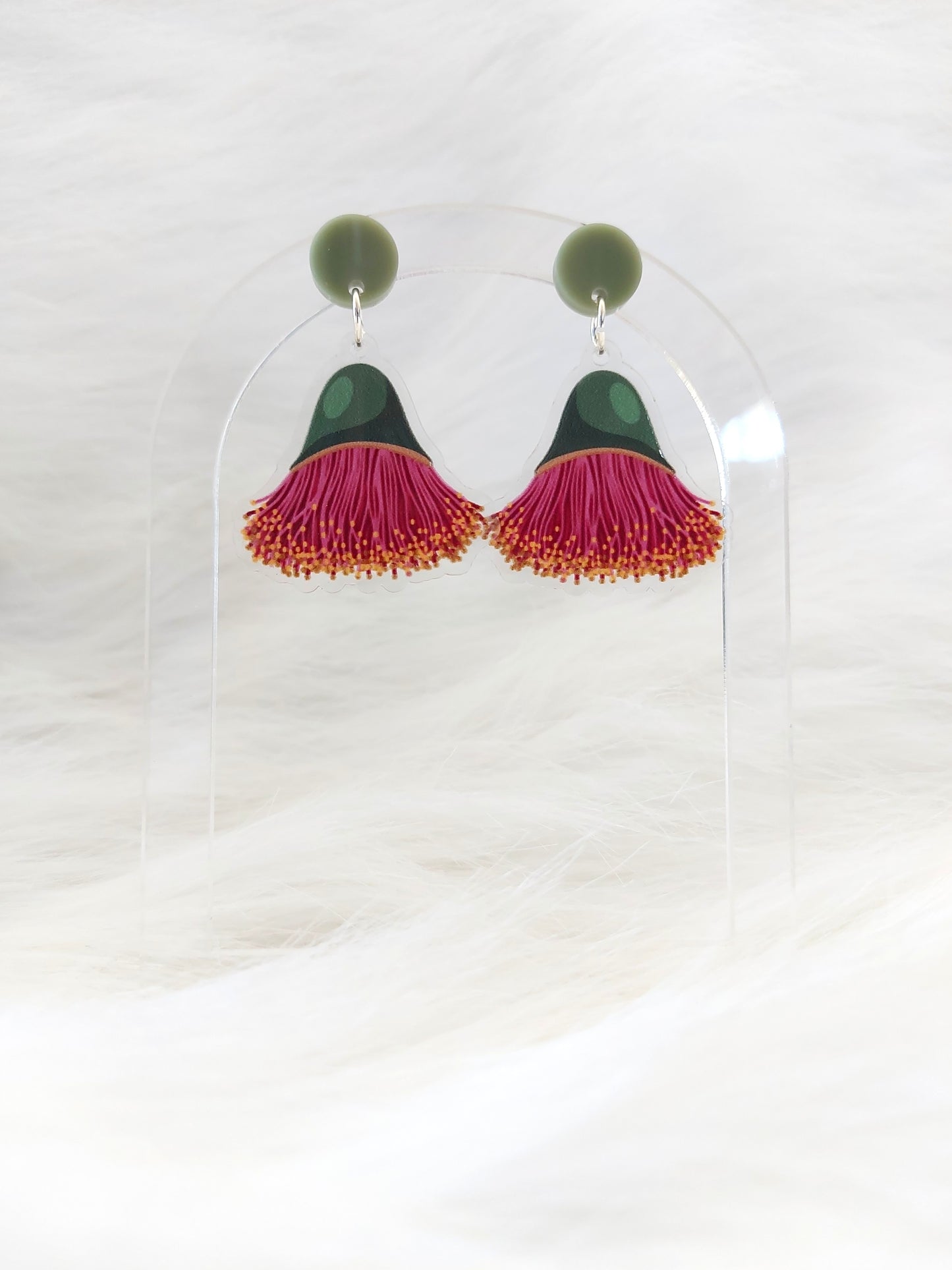 Pair of lightweight acrylic earrings featuring an upside down eucalyptus blossom in pink and green, with a pale olive coloured stud at the top, designed and made in Australia with stainless steel posts and large accessible backs