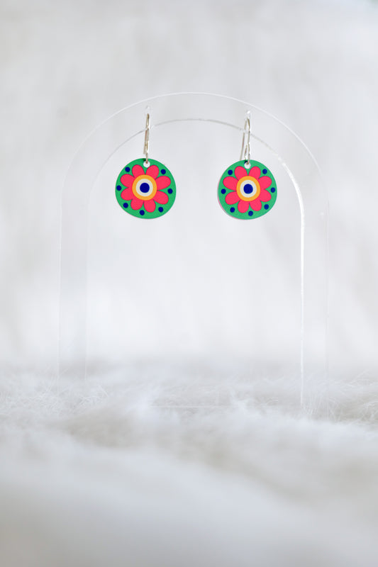 2cm round acrylic earrings with vibrant green background and a pink and yellow flower in the front, stainless steel hooks, displayed against a white background