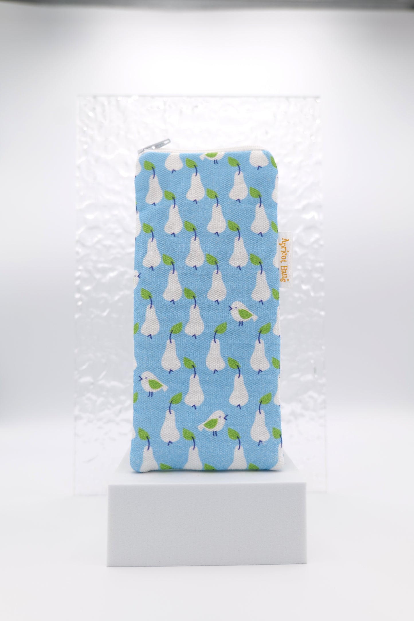 Glasses case featuring the Just Pears design with white pears and small birds arranged on a blue Scandinavian‑inspired background; made from cotton canvas with a zip‑top closure, padded and lined to protect lenses, handmade in Melbourne and certified Australian Made; pattern placement may vary slightly due to the handmade nature of the product.