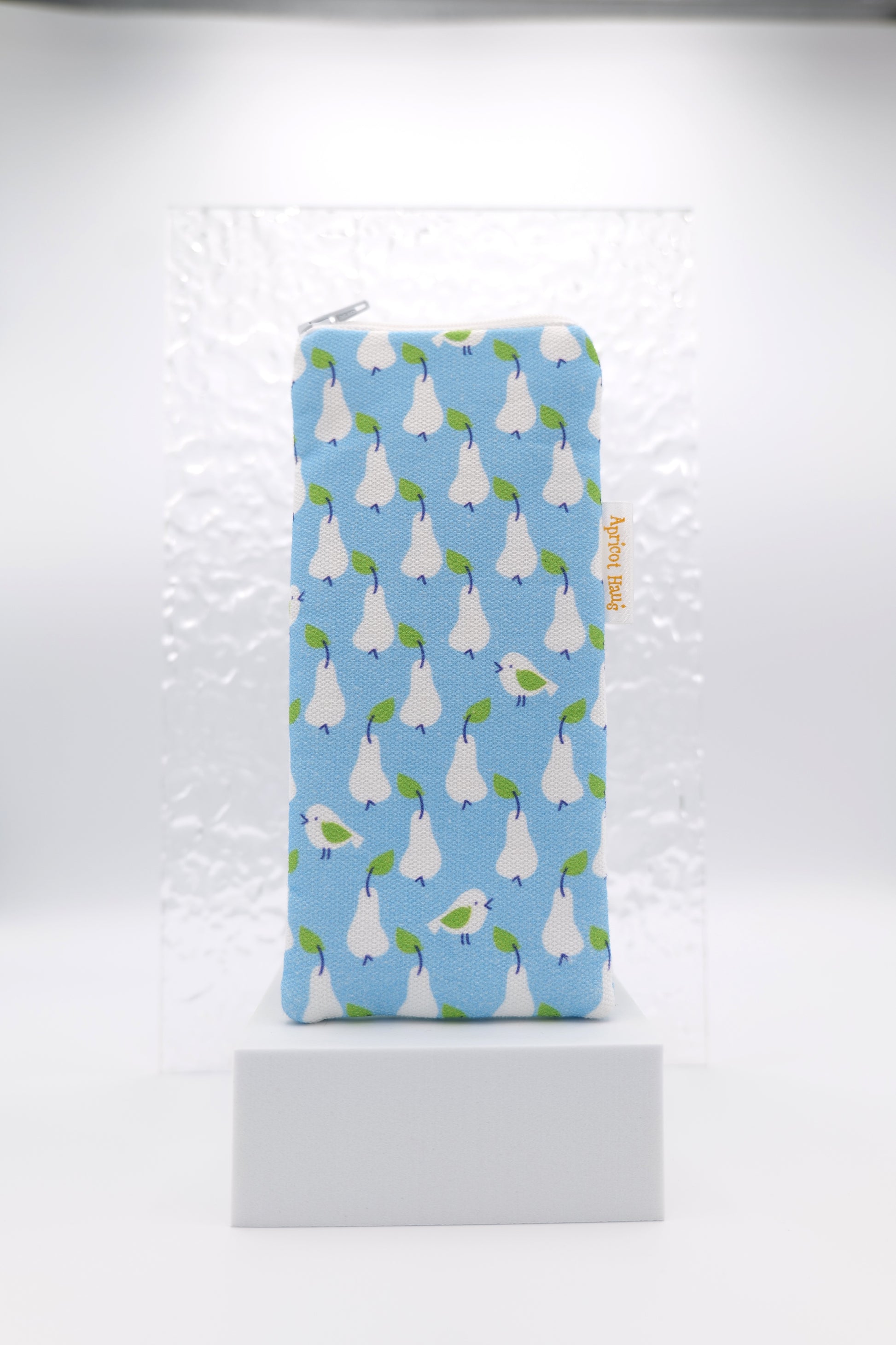 Glasses case featuring the Just Pears design with white pears and small birds arranged on a blue Scandinavian‑inspired background; made from cotton canvas with a zip‑top closure, padded and lined to protect lenses, handmade in Melbourne and certified Australian Made; pattern placement may vary slightly due to the handmade nature of the product.