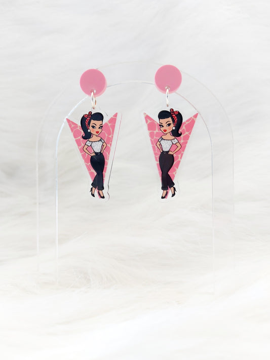 Pair of lightweight acrylic earrings in the shape of a pink downward pointing arrow with a retro-style illustrated girl, pink circular stud at the top, stainless steel posts and large backs, designed and handmade in Australia