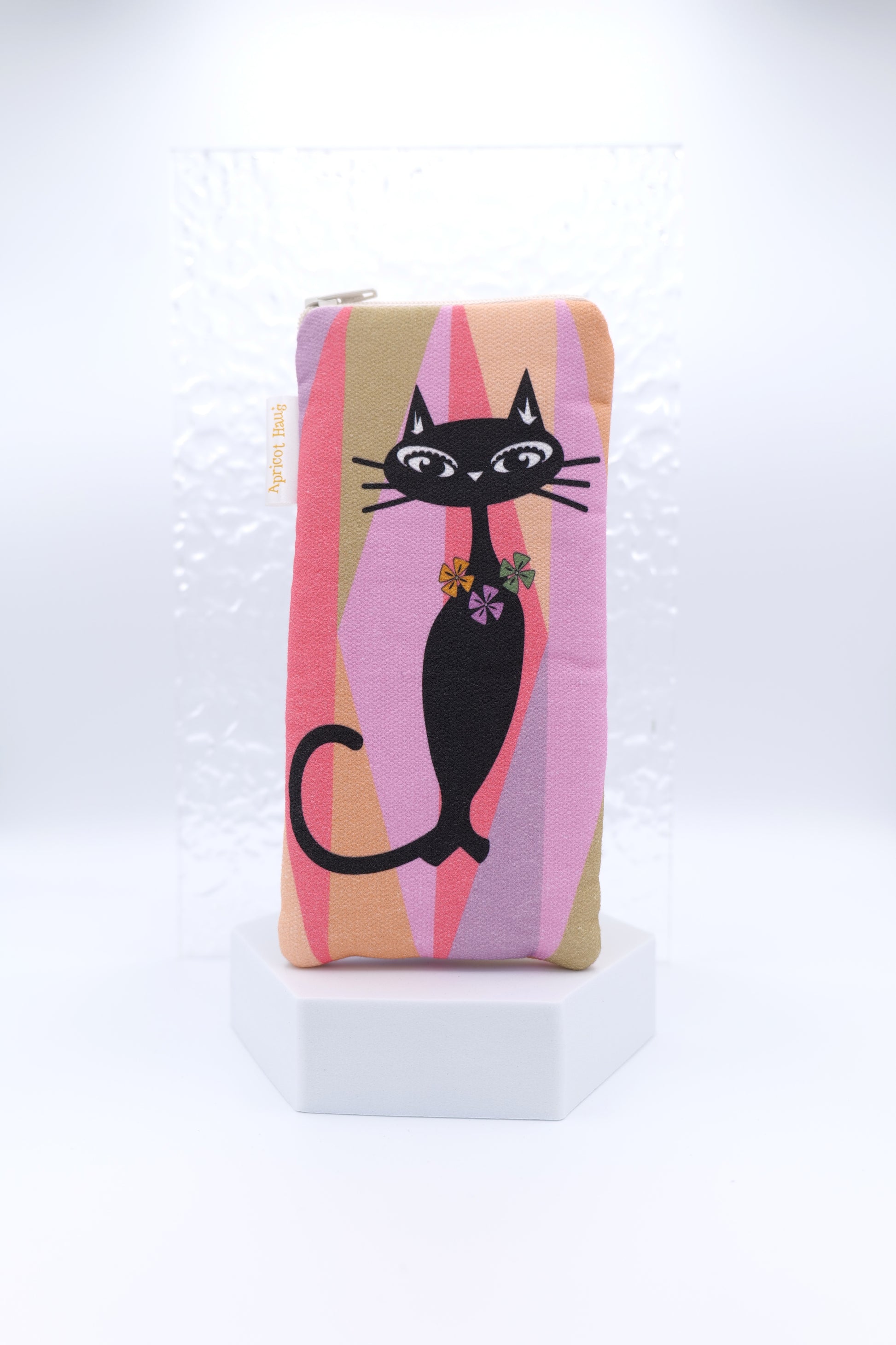 Glasses case featuring the Mod Meow design with a black stylised mid-century cat and background of geometric shapes in a muted retro palette; made from cotton canvas with a zip‑top closure, padded and lined to protect lenses, handmade in Melbourne and certified Australian Made.