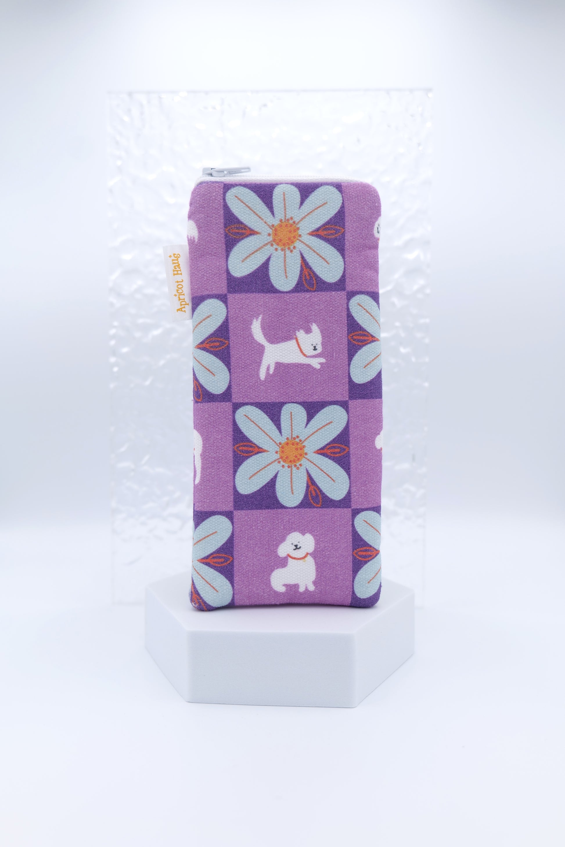Glasses case featuring a My Hero Winky design with a purple check pattern, white cartoon dogs and blue flowers; made from cotton canvas with a zip-top closure, padded and lined to protect lenses, handmade in Melbourne and certified Australian Made; pattern placement may vary slightly due to the handmade nature of the product.
