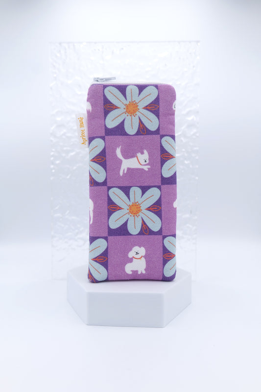 Glasses case featuring a My Hero Winky design with a purple check pattern, white cartoon dogs and blue flowers; made from cotton canvas with a zip-top closure, padded and lined to protect lenses, handmade in Melbourne and certified Australian Made; pattern placement may vary slightly due to the handmade nature of the product.