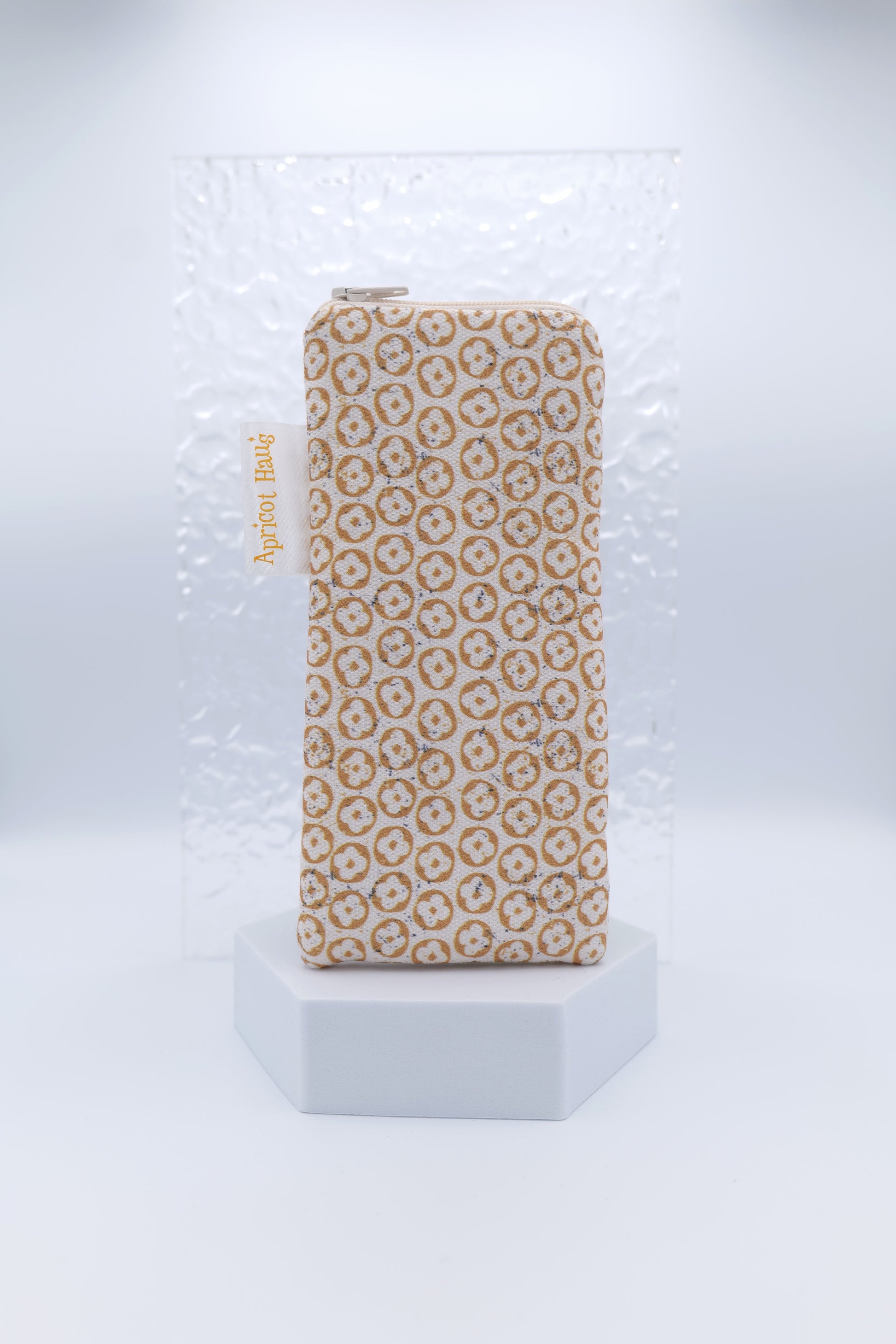 Glasses case with Nordic Beige design featuring a repeating geometric and floral-inspired motif in soft beige and cream; made from cotton canvas with zip top closure, padded and lined with soft cotton, handmade in Melbourne and certified Australian Made; pattern placement may vary slightly due to the handmade nature of the item.