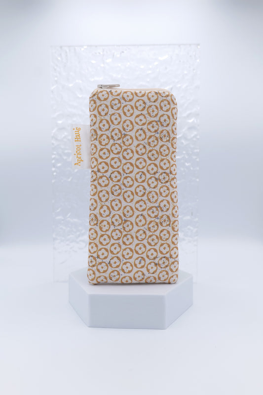 Glasses case with Nordic Beige design featuring a repeating geometric and floral-inspired motif in soft beige and cream; made from cotton canvas with zip top closure, padded and lined with soft cotton, handmade in Melbourne and certified Australian Made; pattern placement may vary slightly due to the handmade nature of the item.