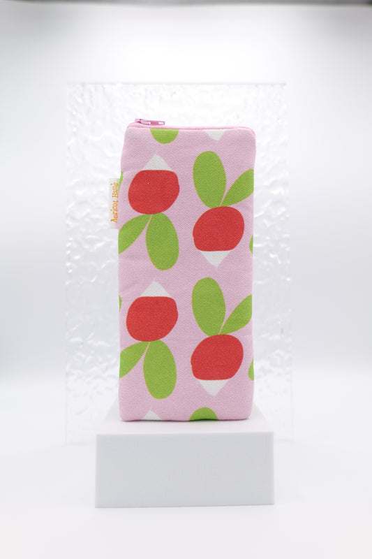 Glasses case featuring the Radishes design with stylised red and white radishes and green leaves on a pink background, illustrated in a simple flat Scandinavian-inspired style; made from cotton canvas with a zip-top closure, padded and lined to protect lenses, handmade in Melbourne and certified Australian Made; pattern placement may vary slightly due to the handmade nature of the product.