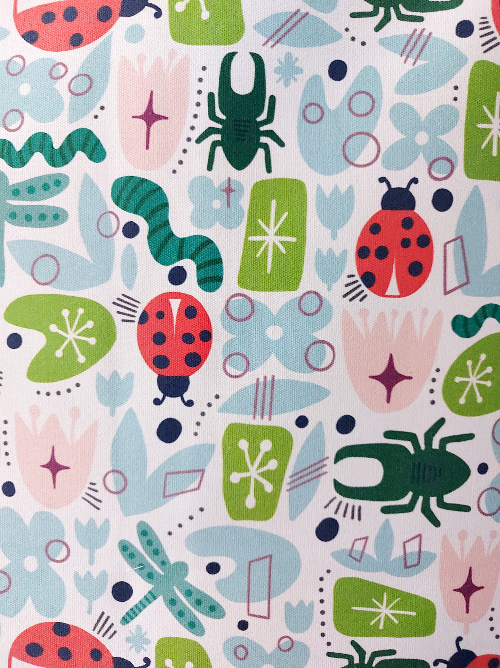 Close up photo of the bugs and flowers in retro colours