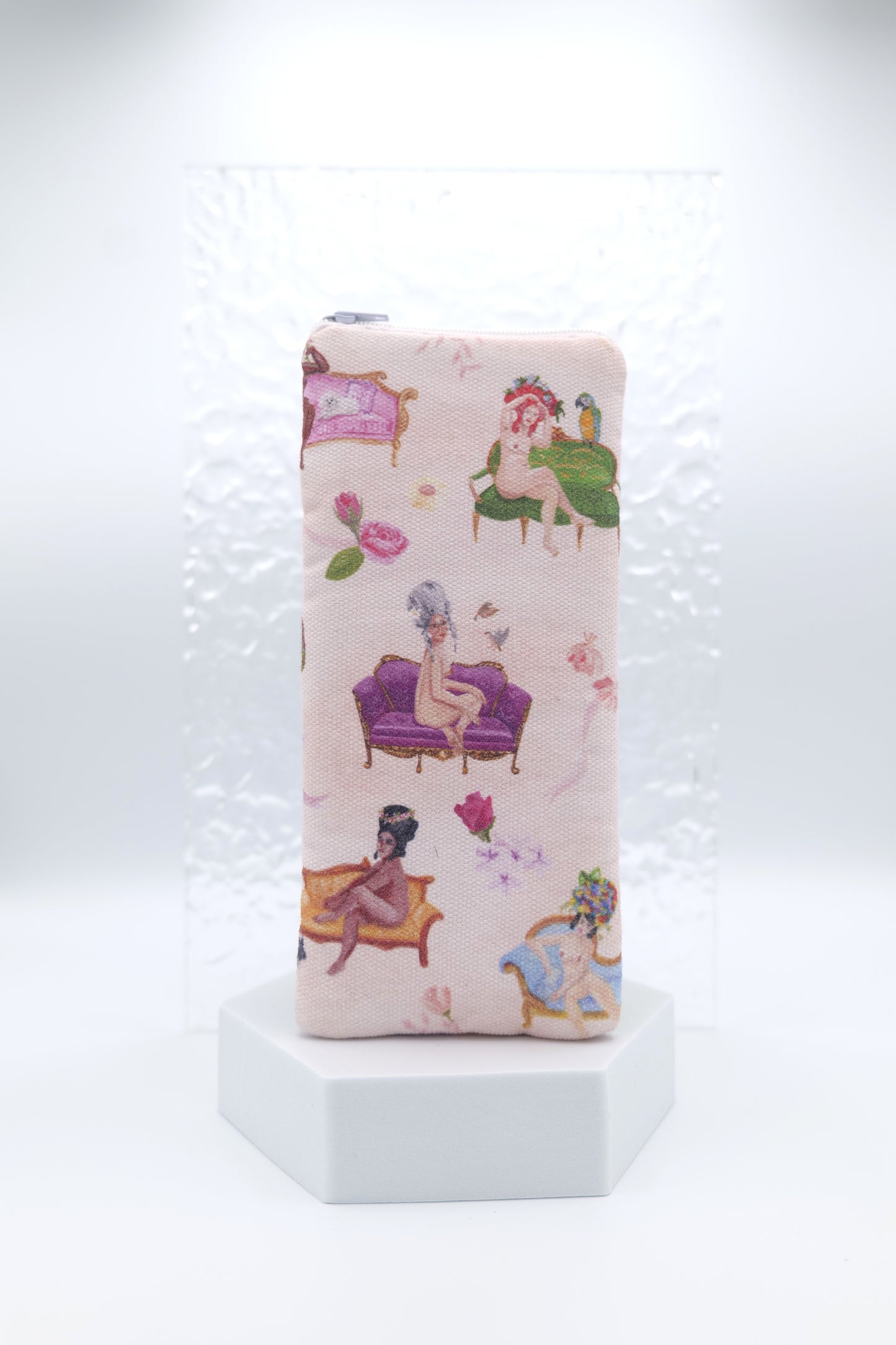 Glasses case featuring a Rococo Nudes design with soft nude figures arranged on ornate decorative couches inspired by Rococo art; made from cotton canvas with a zip‑top closure, padded and lined to protect lenses, handmade in Melbourne and certified Australian Made; pattern placement may vary slightly due to the handmade nature of the product.