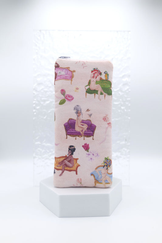 Glasses case featuring a Rococo Nudes design with soft nude figures arranged on ornate decorative couches inspired by Rococo art; made from cotton canvas with a zip‑top closure, padded and lined to protect lenses, handmade in Melbourne and certified Australian Made; pattern placement may vary slightly due to the handmade nature of the product.