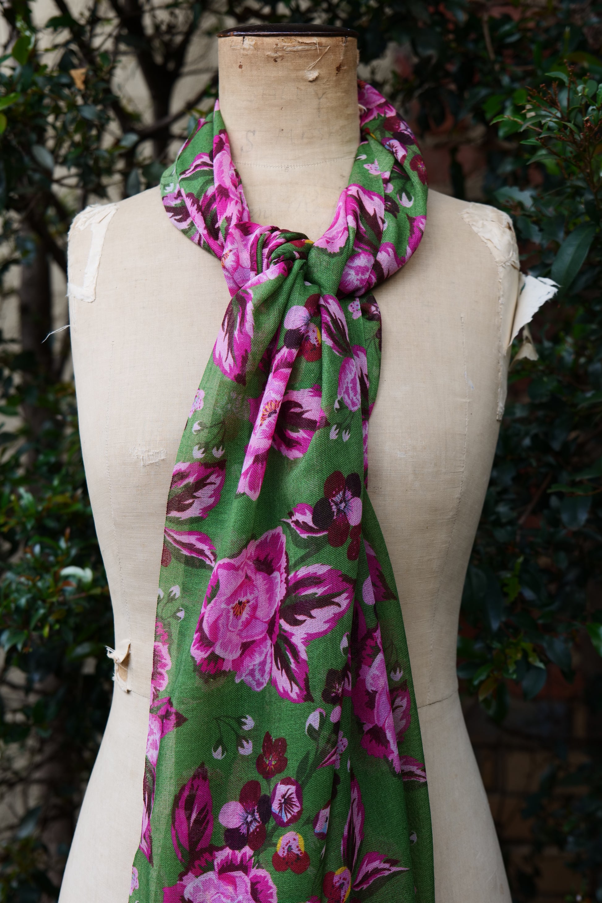 The Rosewood Scarf displayed on a mannequin tied around the neck
