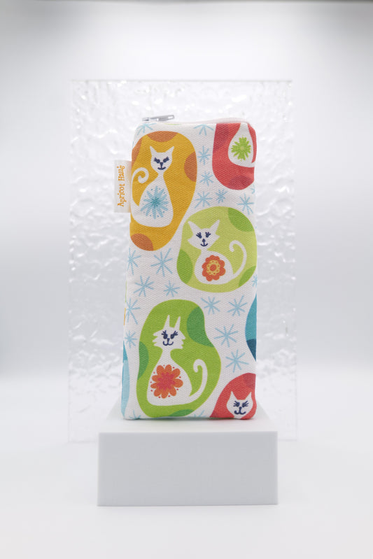 Glasses case featuring Vintage Kitty design with colourful stylised cats, floral motifs and starburst accents on a white background; made from cotton canvas with a zip-top closure, padded and lined to protect lenses, handmade in Melbourne and certified Australian Made; pattern placement may vary slightly due to the handmade nature of the product.